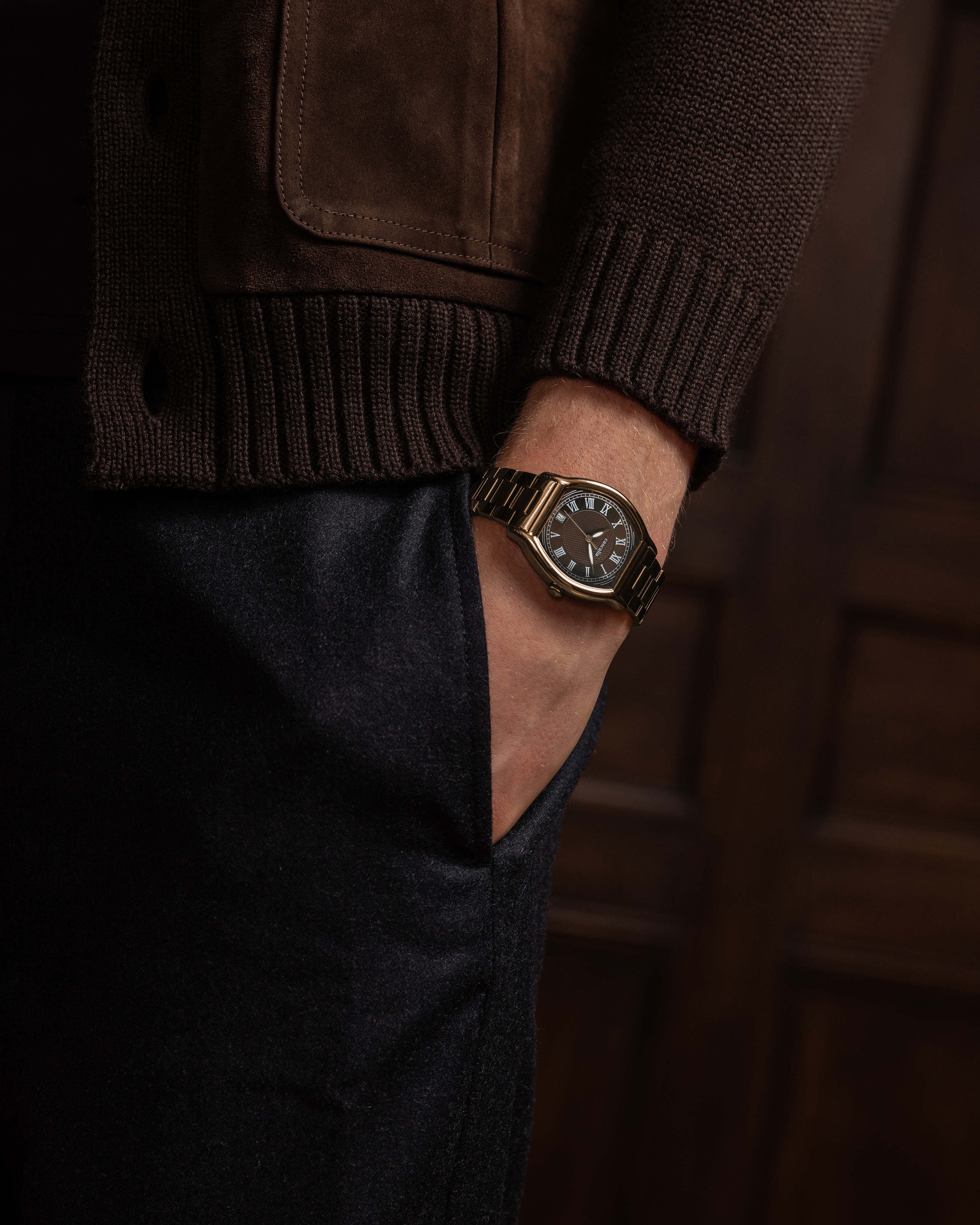 Caratello Rosegold Automatic Brown watch worn on wrist — rose gold timepiece styled with casual brown jacket, lifestyle view 2